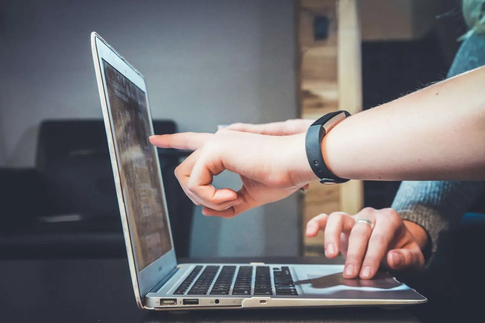 Person using a laptop to review search and customer feedback data